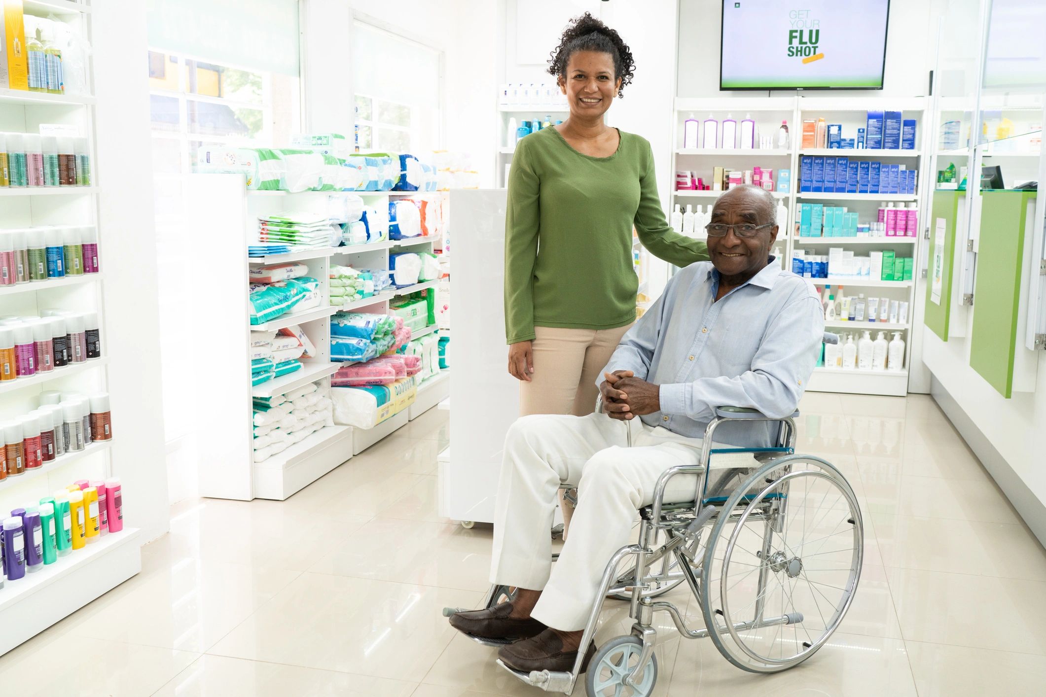 Caregiver assisting a senior in a pharmacy
