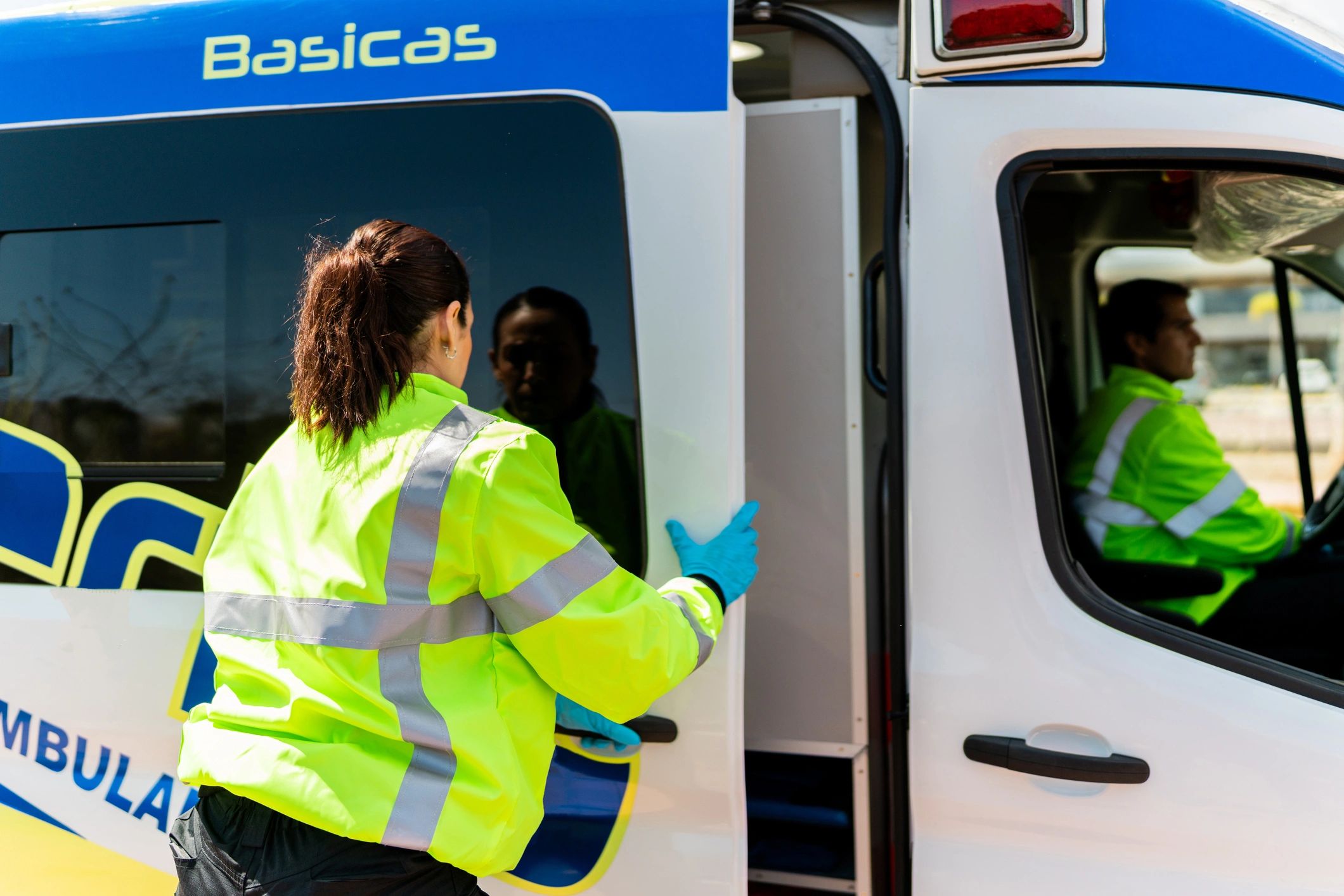 Paramedic opening an ambulance door
